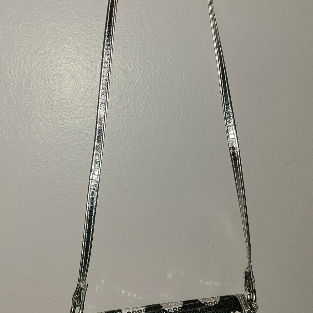 Sequins all over black and‎ silver poke a dots purse